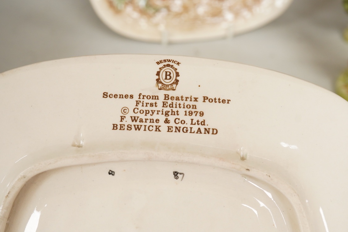 A collection of Beswick and Royal Albert Beatrix Potter figures to include Little Black Rabbit and The Head Gardener, together with two plates, 19cm wide